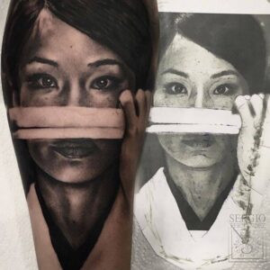 Hyperrealistic Lucy Liu portrait tattoo artwork with covered eyes concept