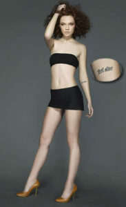 Elina Ivanova showing her hip tattoo in a black bandeau outfit