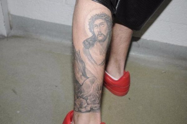 “Justin Bieber’s leg tattoo showing a detailed Jesus portrait.”